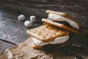 Smores on the parchment on the wooden table